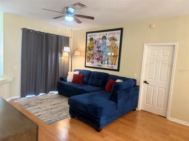 a living room with furniture and a window