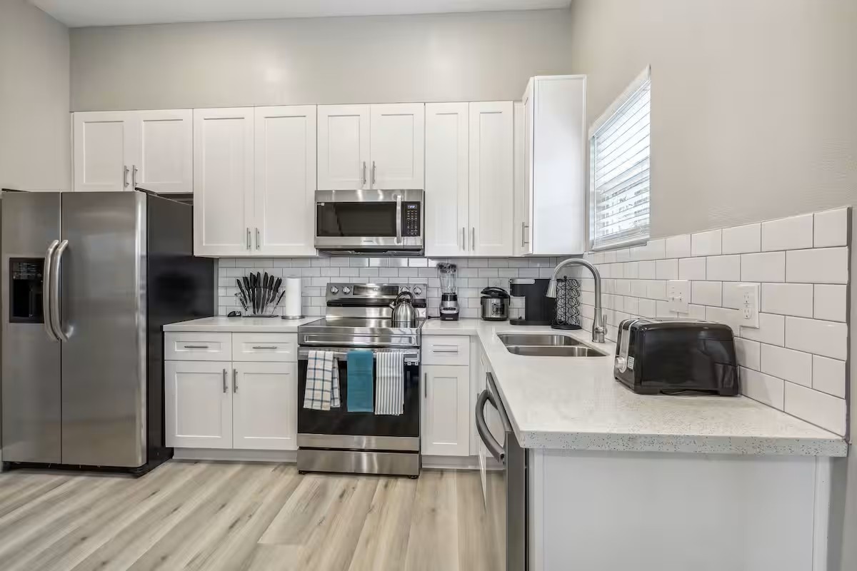 2502 Sam Wilson Street Houston, TX 77020 - Photo 4 of 15 a kitchen with stainless steel appliances a stove a sink a microwave and refrigerator
