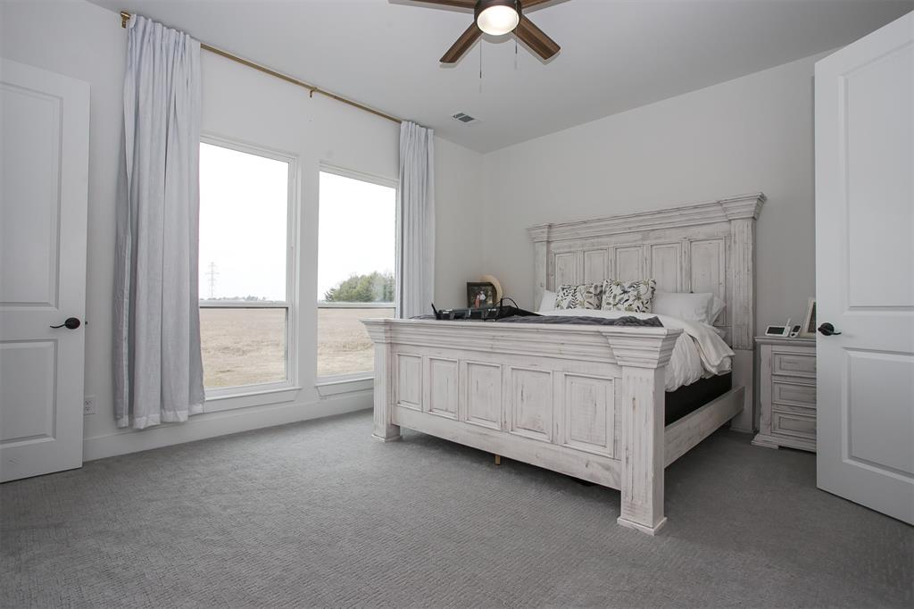 1006 Johnson Trail Bells, TX 75414 - Photo 12 of 19 a bedroom with a bed and a window