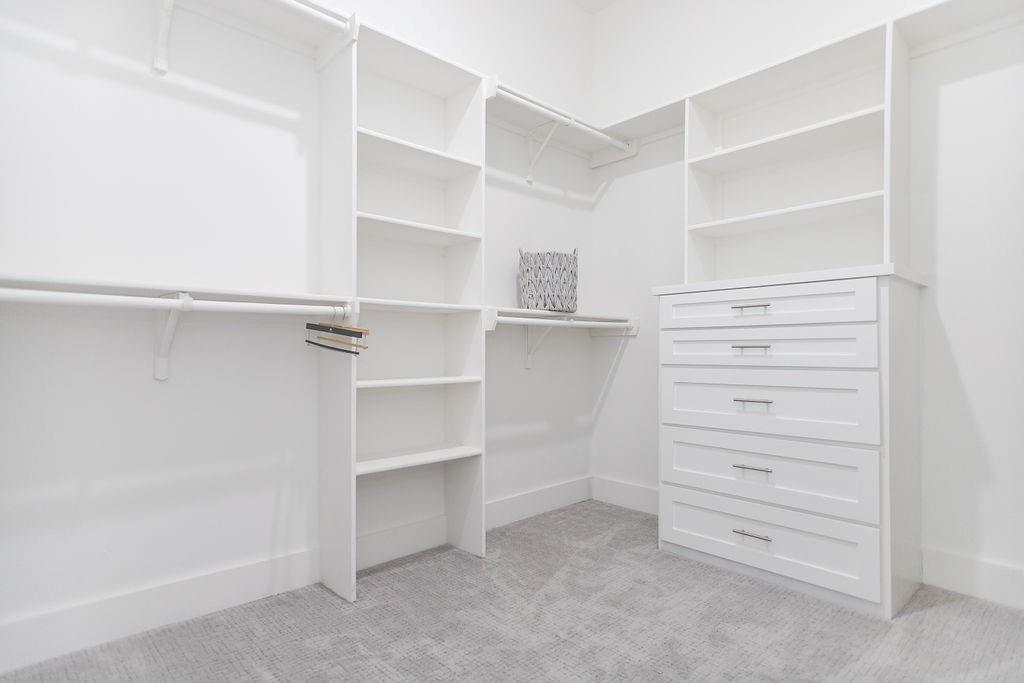 1006 Johnson Trail Bells, TX 75414 - Photo 13 of 19 a view of walk in closet with empty racks