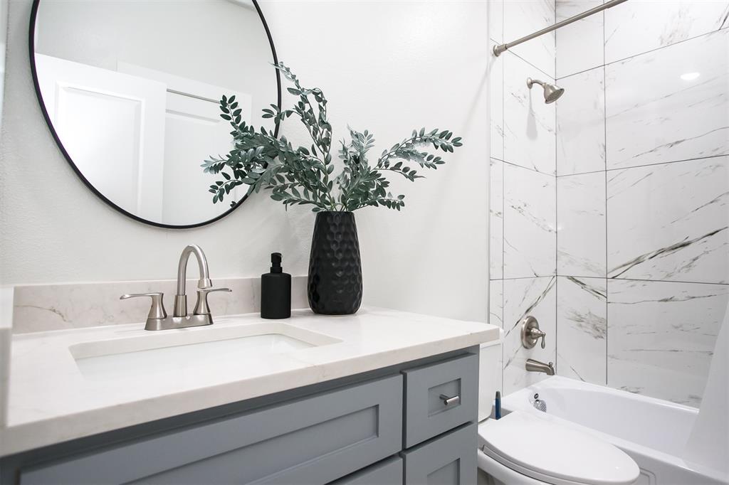 1006 Johnson Trail Bells, TX 75414 - Photo 14 of 19 a bathroom with a sink and a mirror