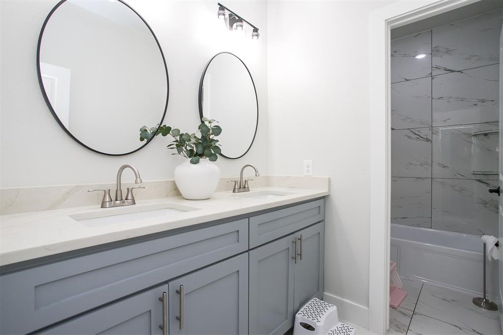 1006 Johnson Trail Bells, TX 75414 - Photo 16 of 19 a bathroom with a sink and a mirror