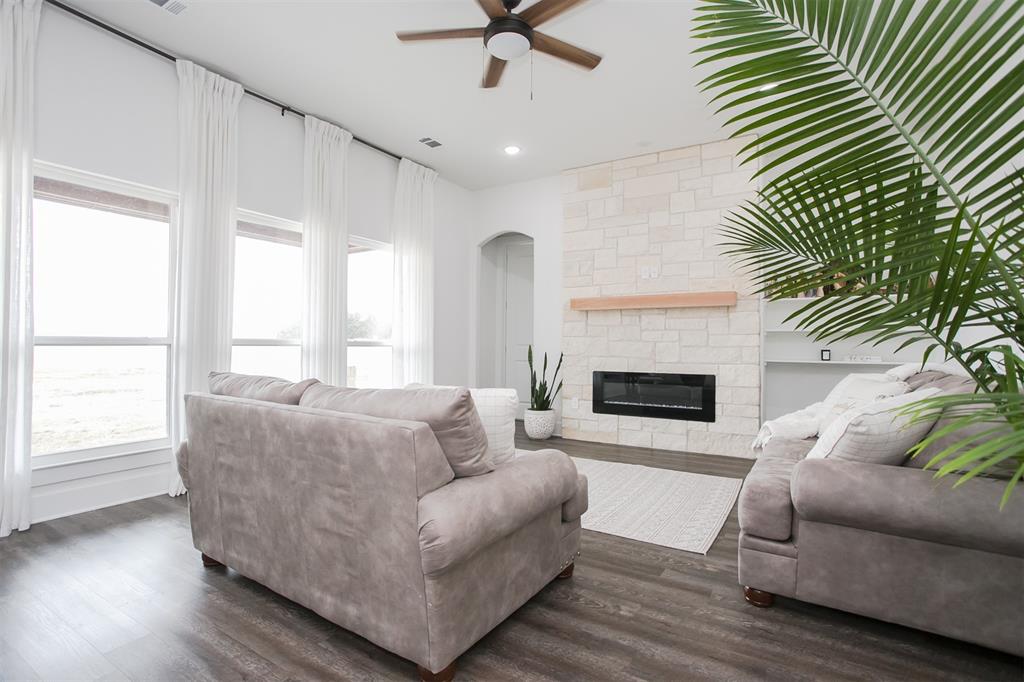 1006 Johnson Trail Bells, TX 75414 - Photo 4 of 19 a living room with furniture and a fireplace