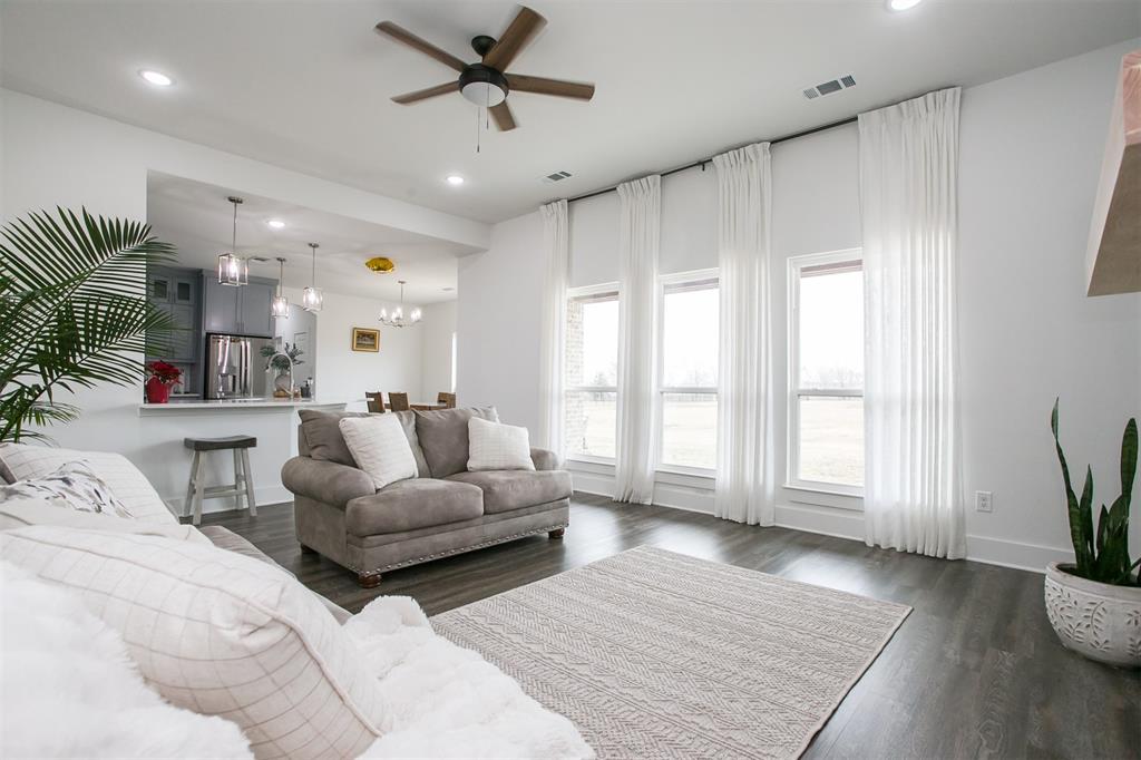 1006 Johnson Trail Bells, TX 75414 - Photo 5 of 19 a living room with furniture and a large window