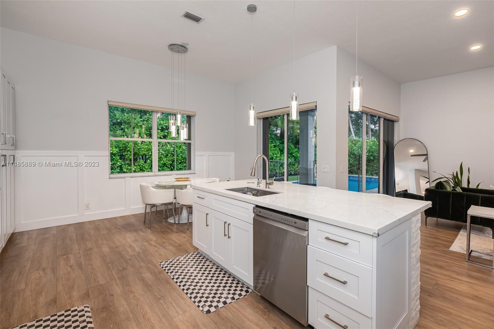 1955 Timberline Road Weston, FL 33327 - Photo 18 of 48 a kitchen that has a sink and a stove in it