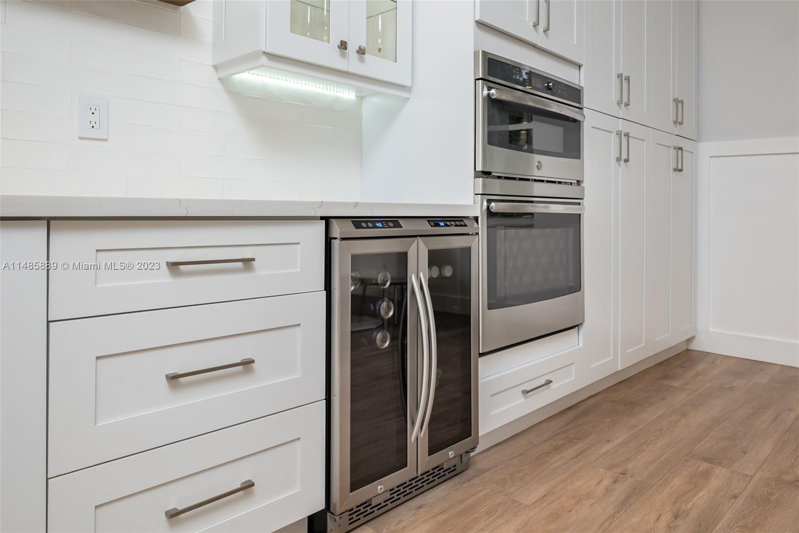 1955 Timberline Road Weston, FL 33327 - Photo 19 of 48 a kitchen with stainless steel appliances and cabinets