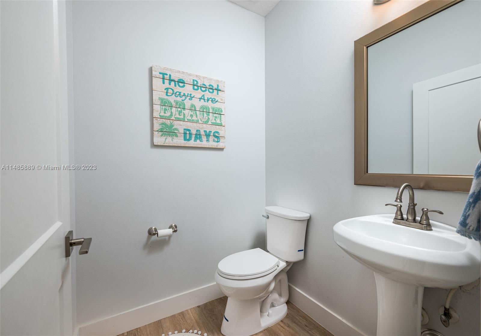 1955 Timberline Road Weston, FL 33327 - Photo 21 of 48 a bathroom with a sink a toilet and a mirror