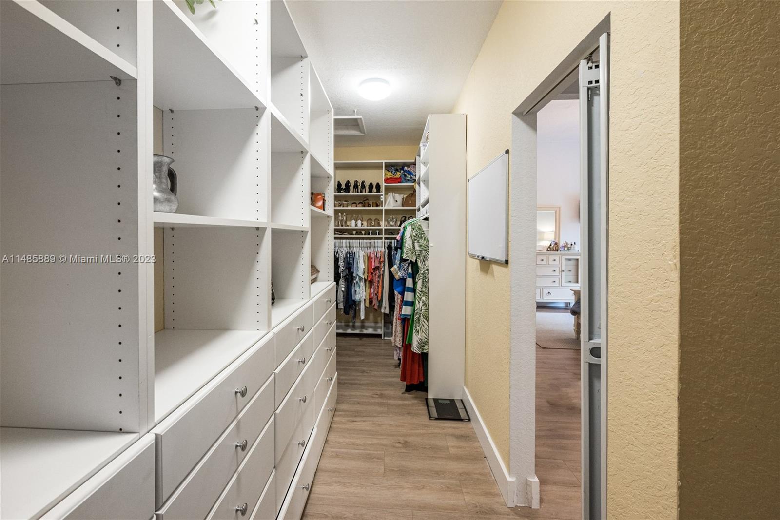 1955 Timberline Road Weston, FL 33327 - Photo 26 of 48 a walk in closet with white walls