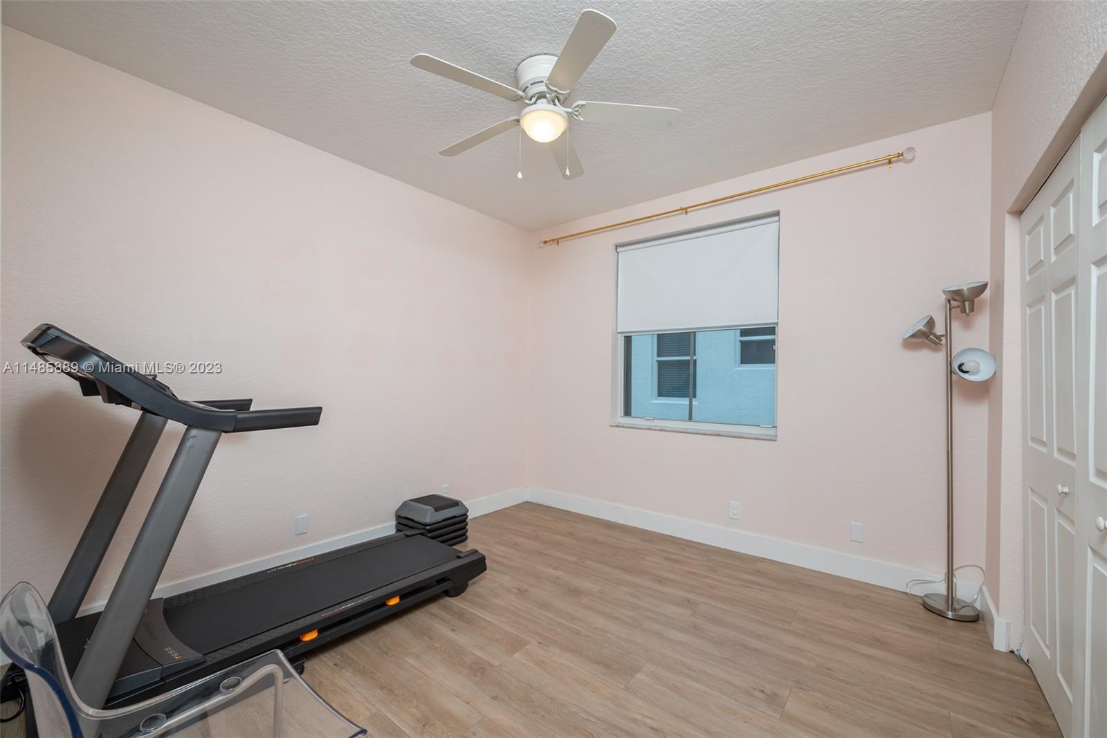 1955 Timberline Road Weston, FL 33327 - Photo 28 of 48 a room with gym equipment and a window