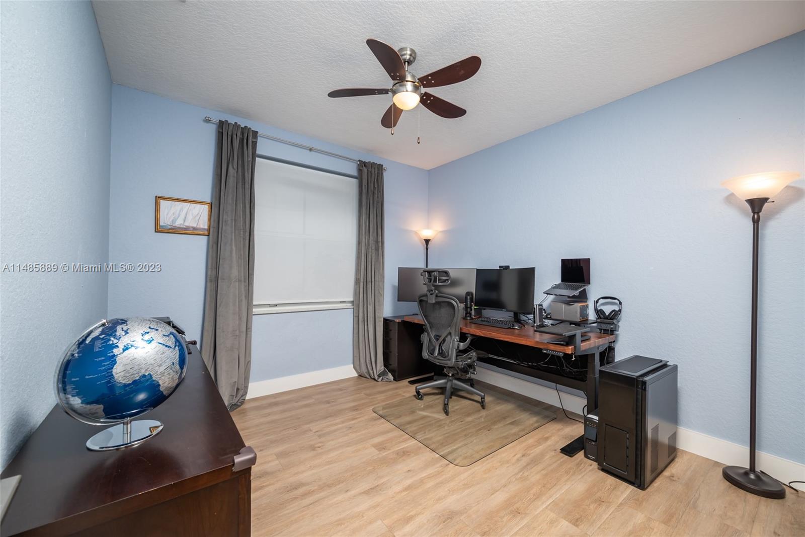 1955 Timberline Road Weston, FL 33327 - Photo 30 of 48 a work room with furniture and a ceiling fan