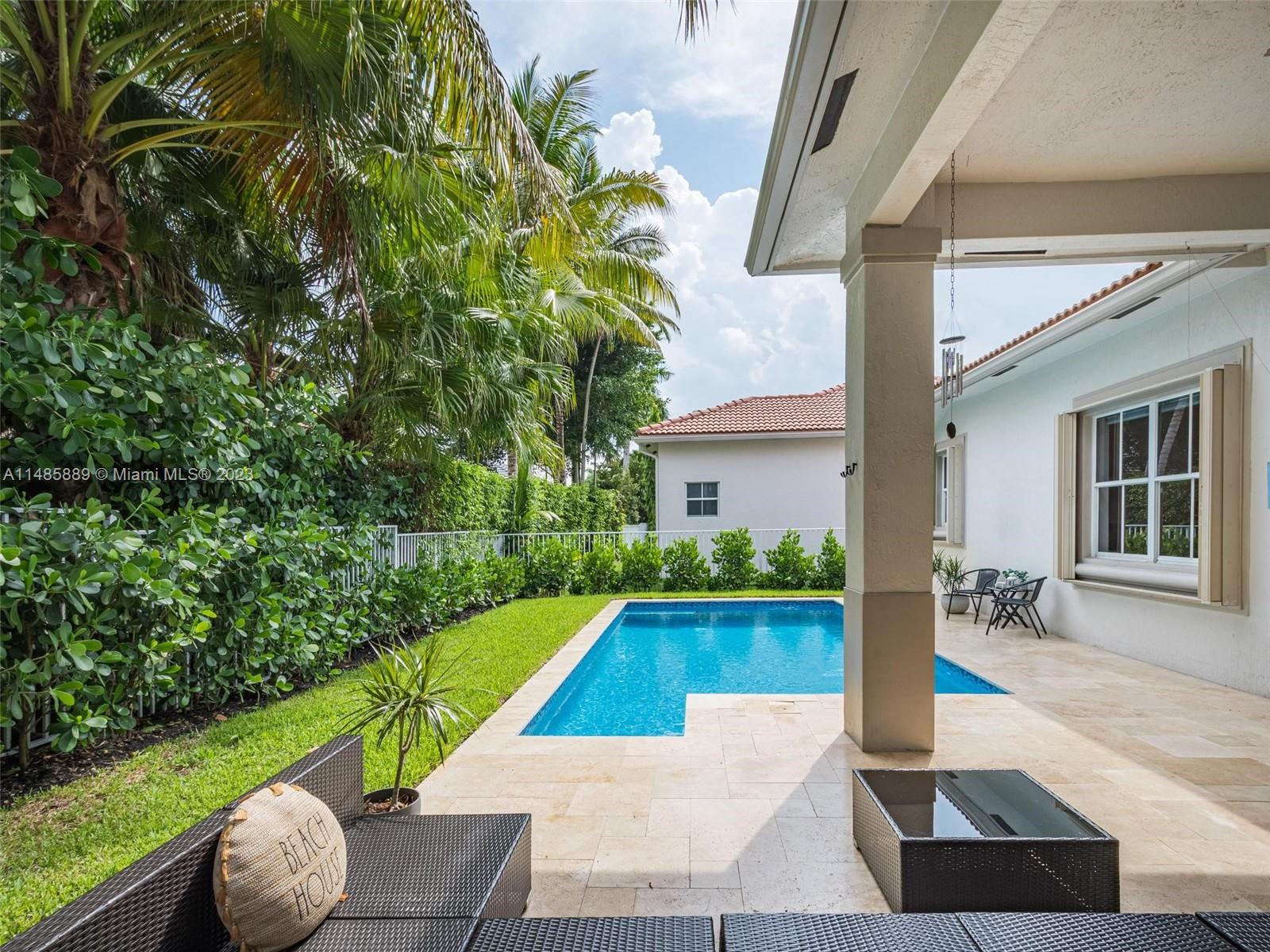 1955 Timberline Road Weston, FL 33327 - Photo 3 of 48 a view of backyard with swimming pool and seating
