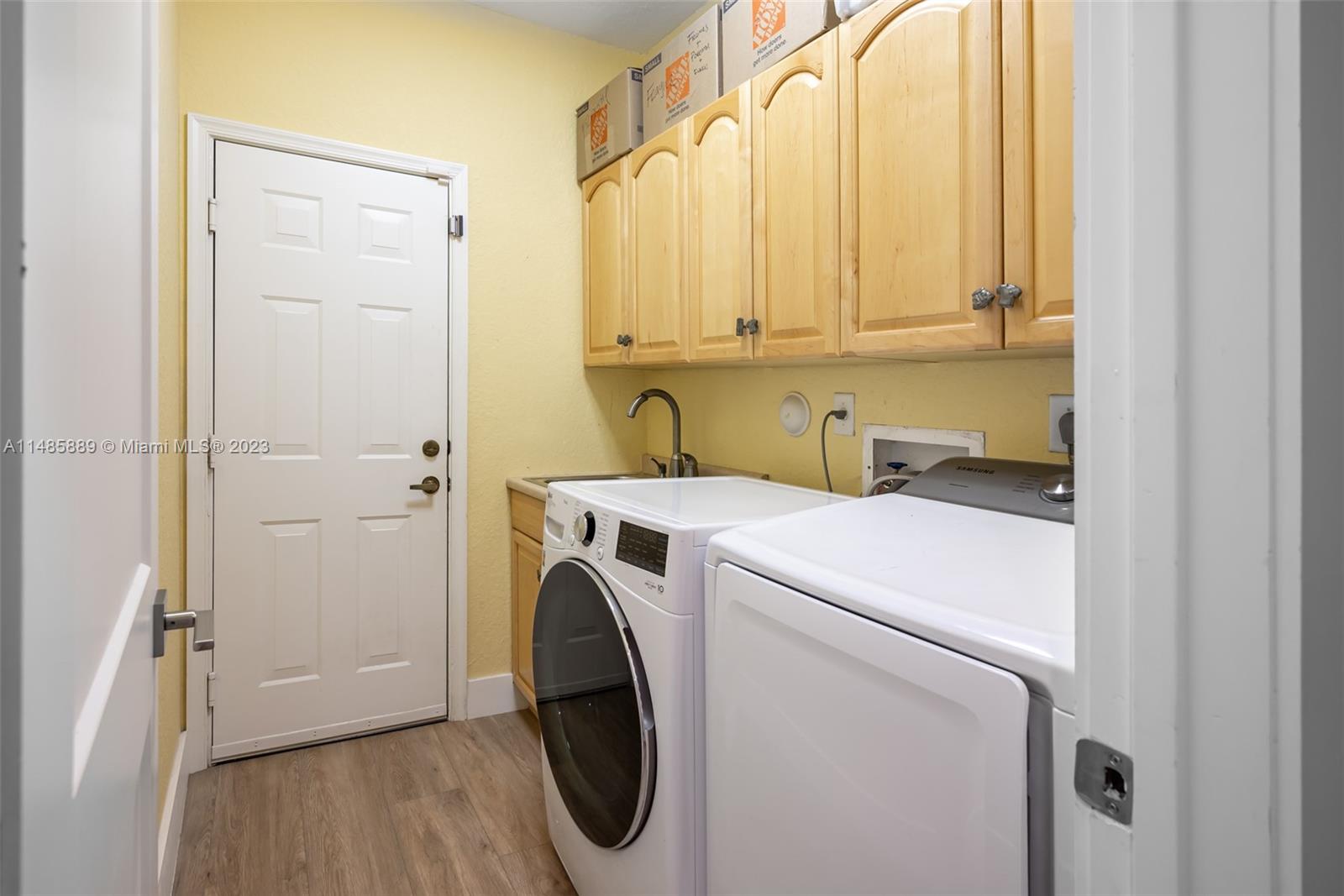 1955 Timberline Road Weston, FL 33327 - Photo 32 of 48 a utility room with dryer and washer