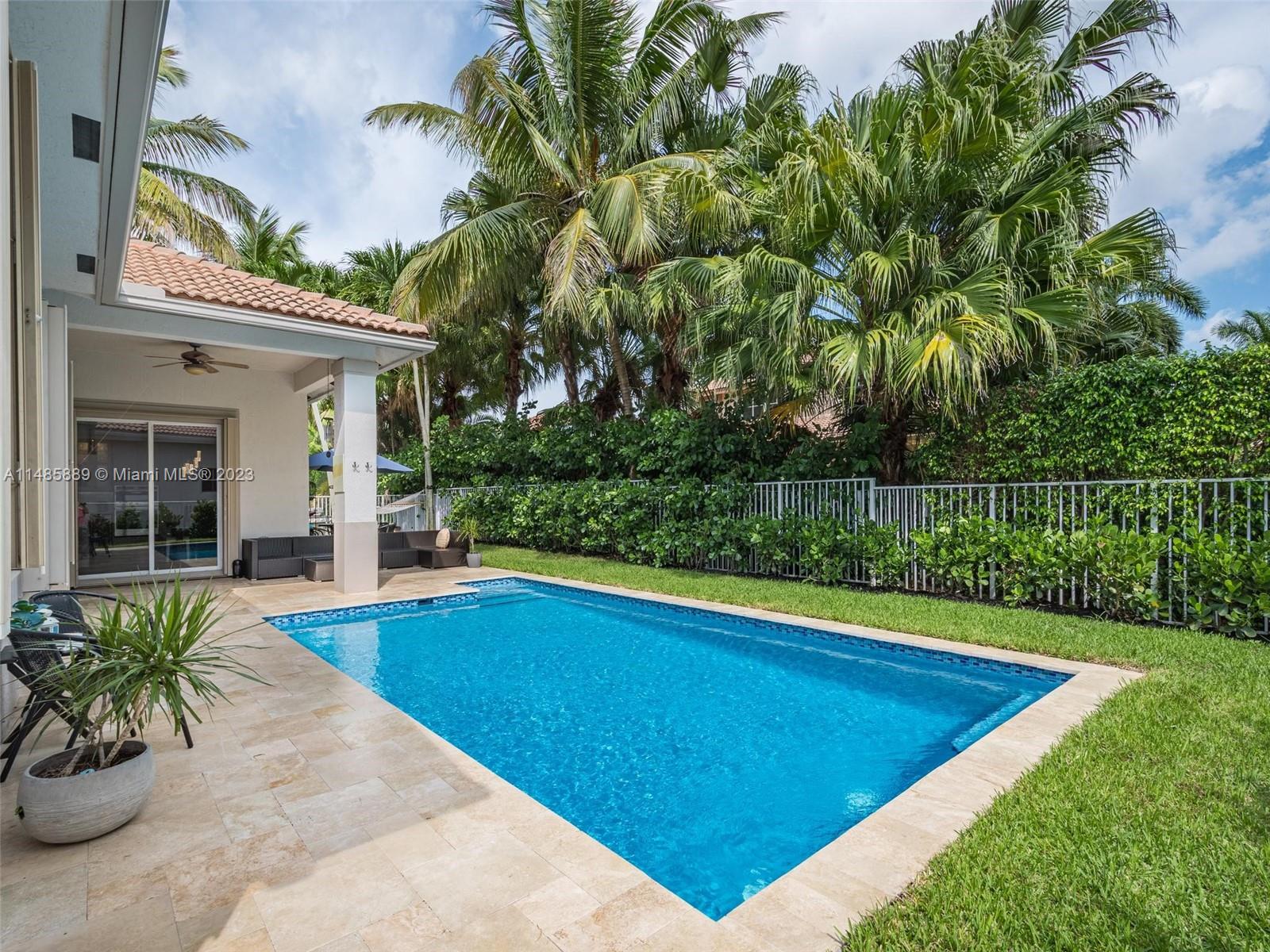 1955 Timberline Road Weston, FL 33327 - Photo 36 of 48 a view of a backyard with swimming pool
