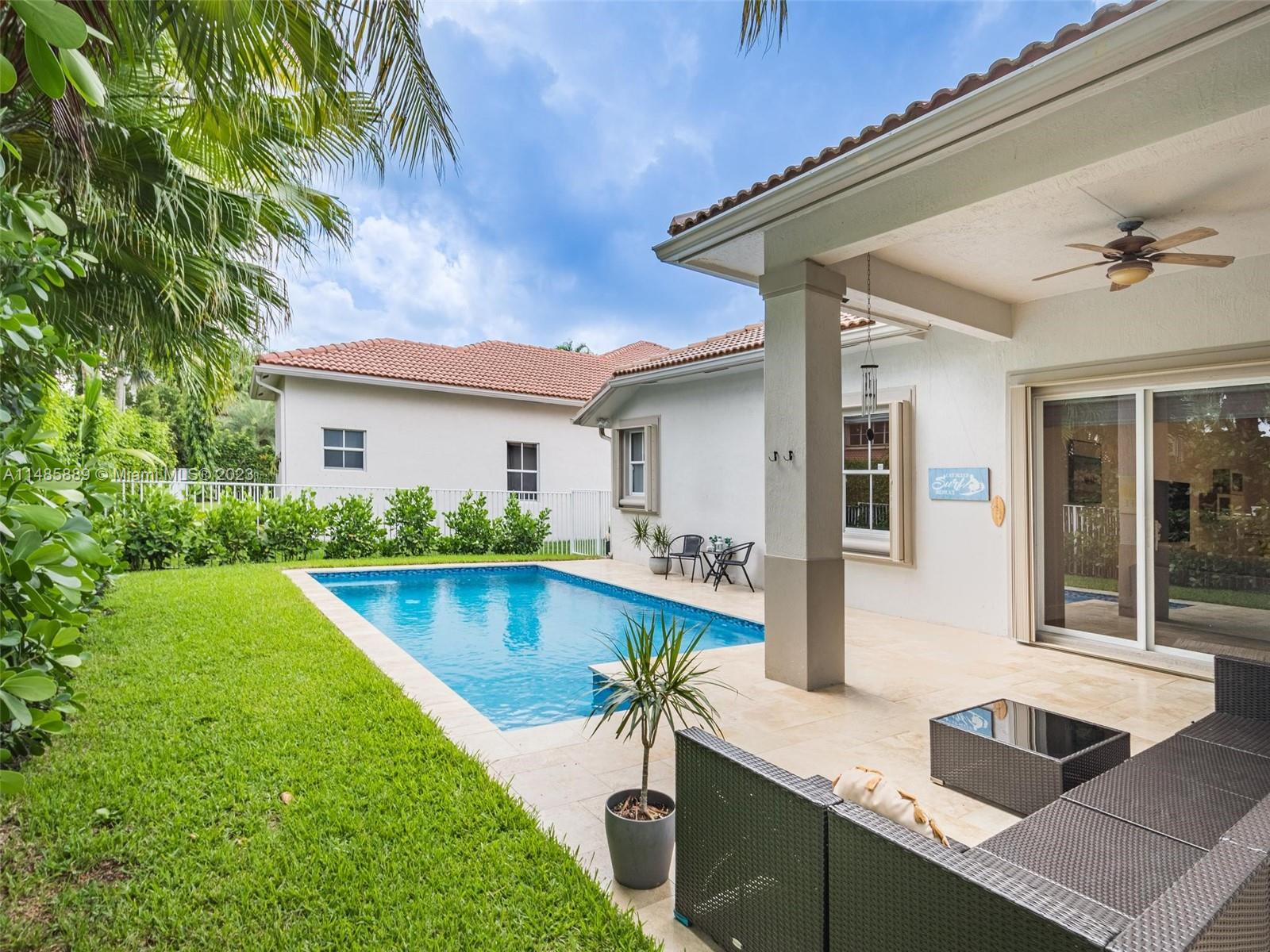 1955 Timberline Road Weston, FL 33327 - Photo 38 of 48 a view of house with swimming pool outdoor seating