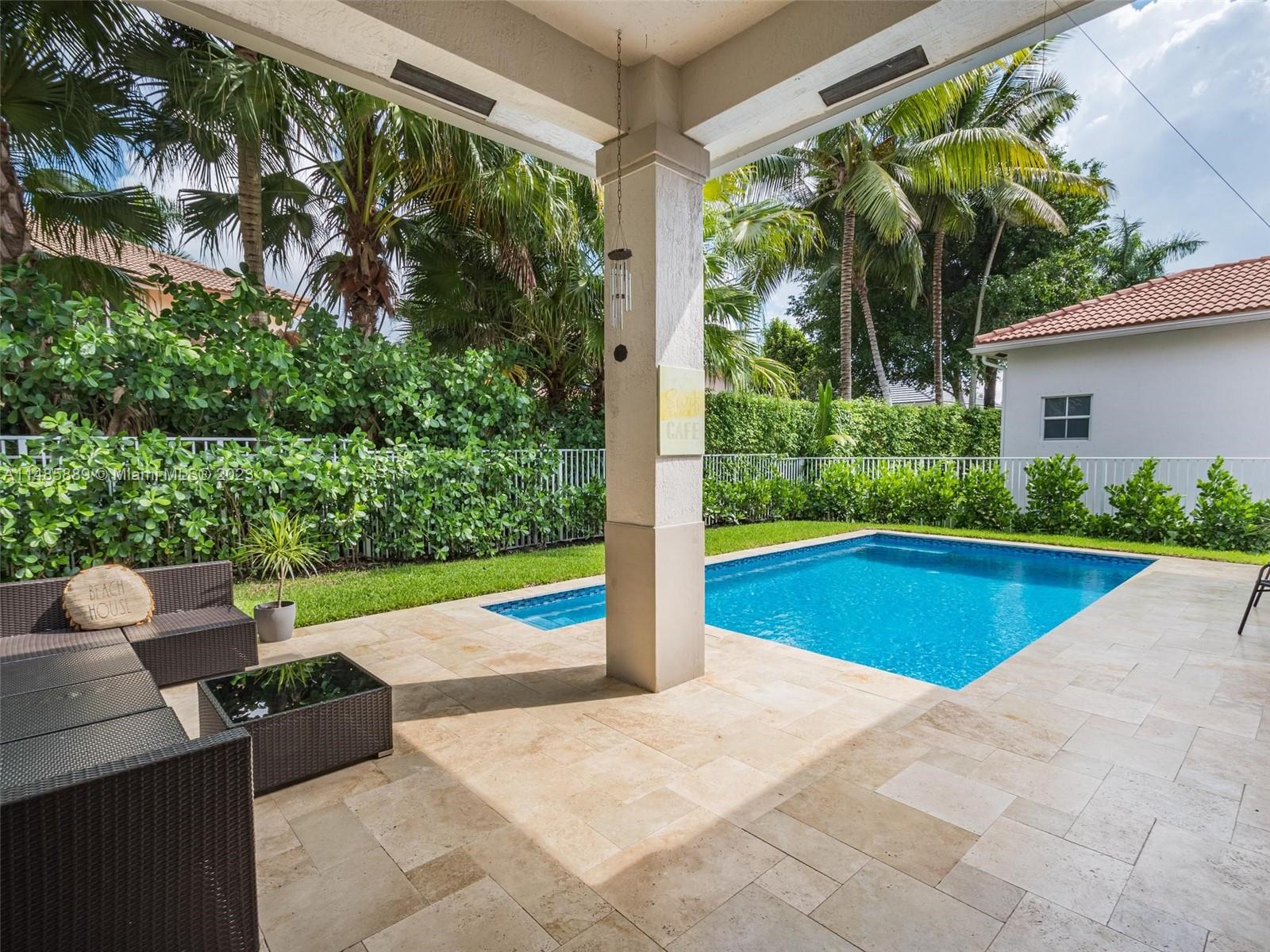 1955 Timberline Road Weston, FL 33327 - Photo 4 of 48 a view of swimming pool with lawn chairs and plants