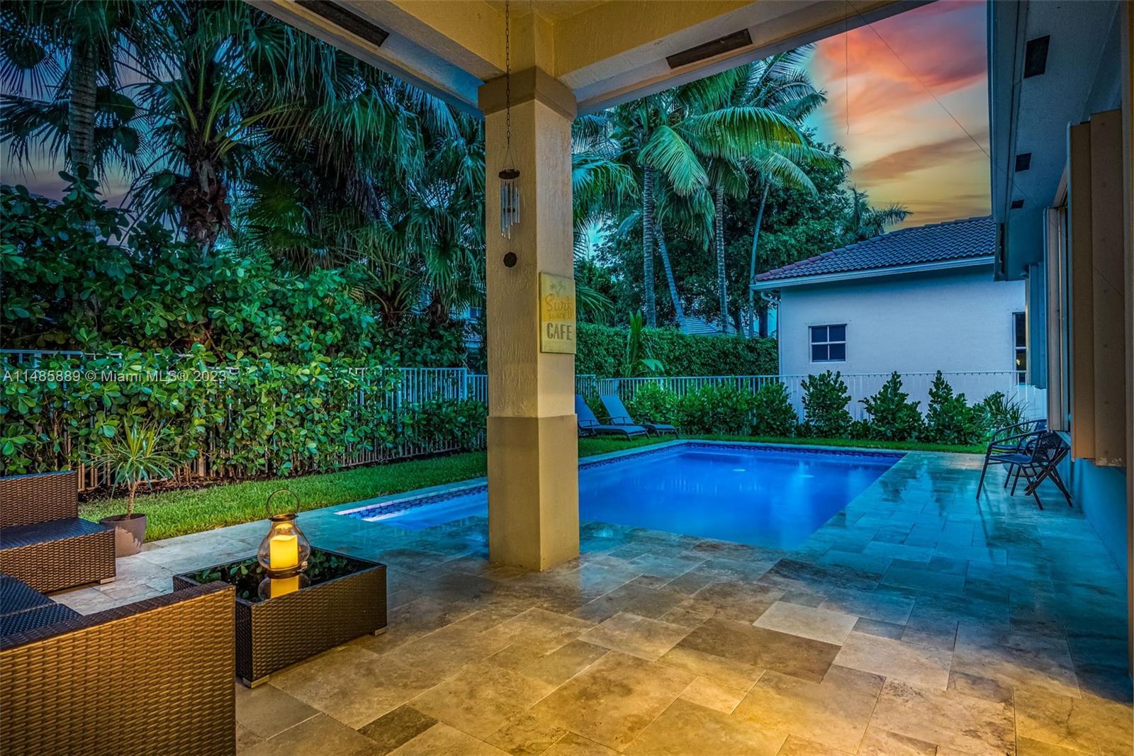 1955 Timberline Road Weston, FL 33327 - Photo 41 of 48 a view of backyard with plants and palm trees