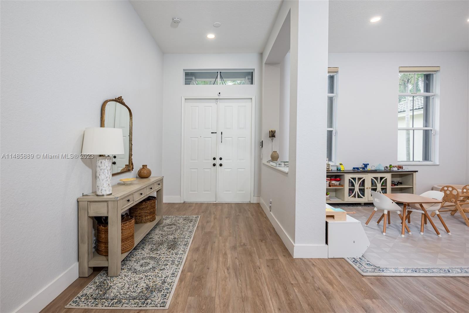 1955 Timberline Road Weston, FL 33327 - Photo 8 of 48 a view of a kitchen with furniture and wooden floor