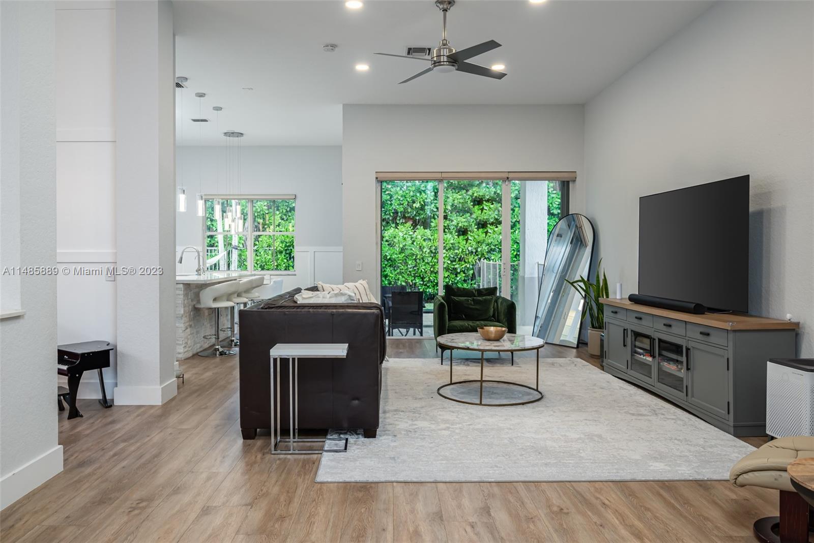1955 Timberline Road Weston, FL 33327 - Photo 10 of 48 a living room with furniture and a flat screen tv