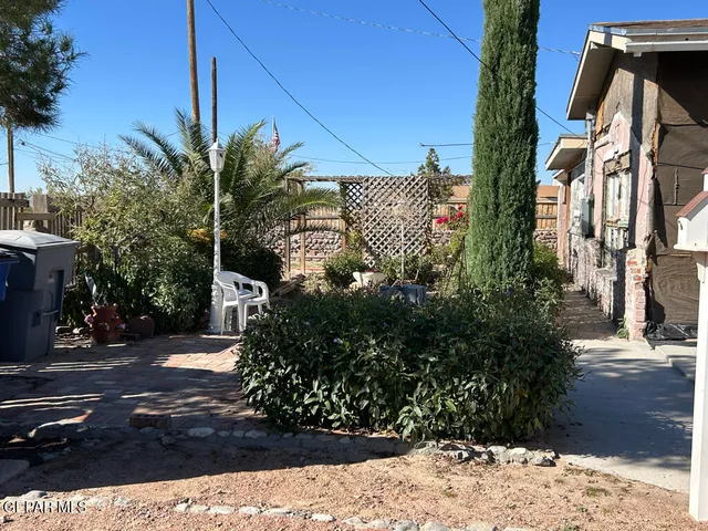 a view of a backyard of the house