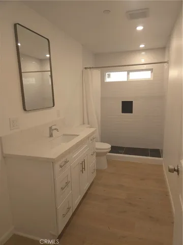 a bathroom with a double vanity sink and mirror