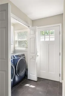 a view of a two chairs and table in the balcony