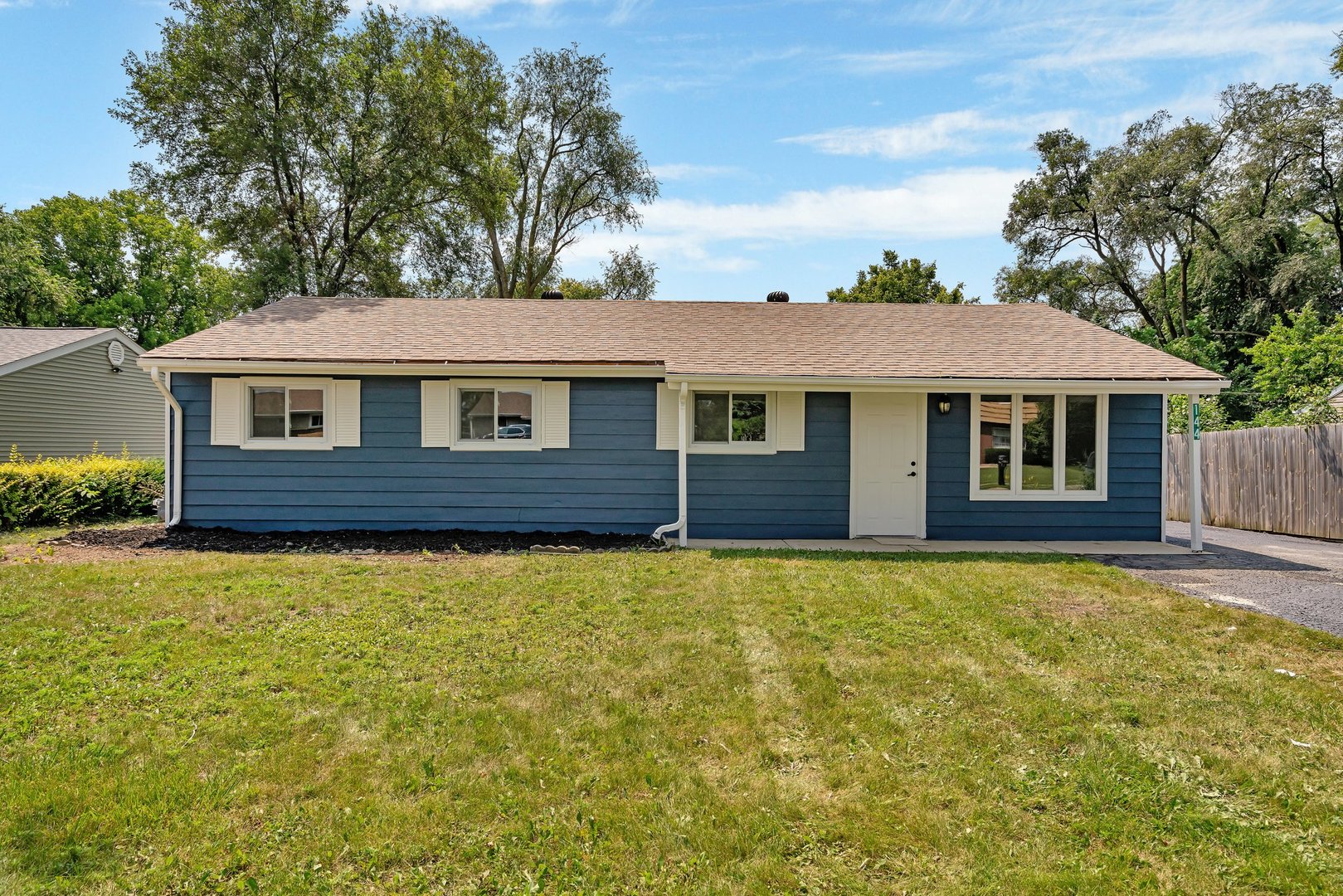 144 Queenswood Road Bolingbrook, IL 60440 - Photo 1 of 15 a front view of a house with yard