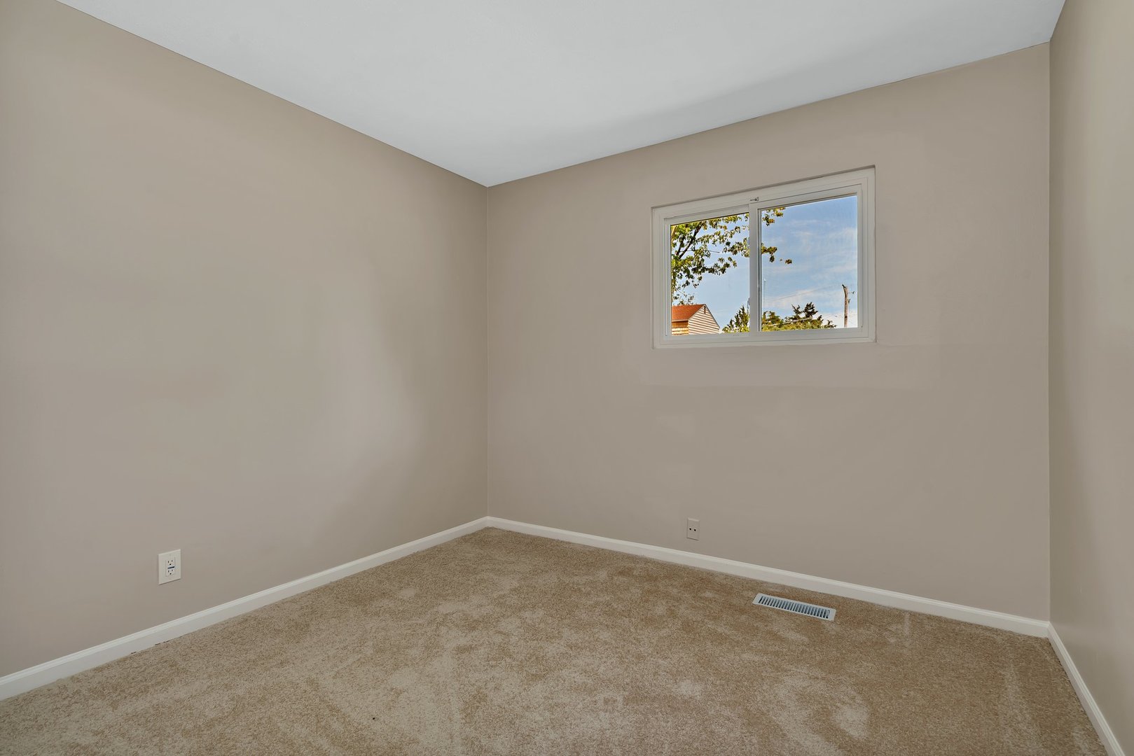 144 Queenswood Road Bolingbrook, IL 60440 - Photo 12 of 15 an empty room with a window