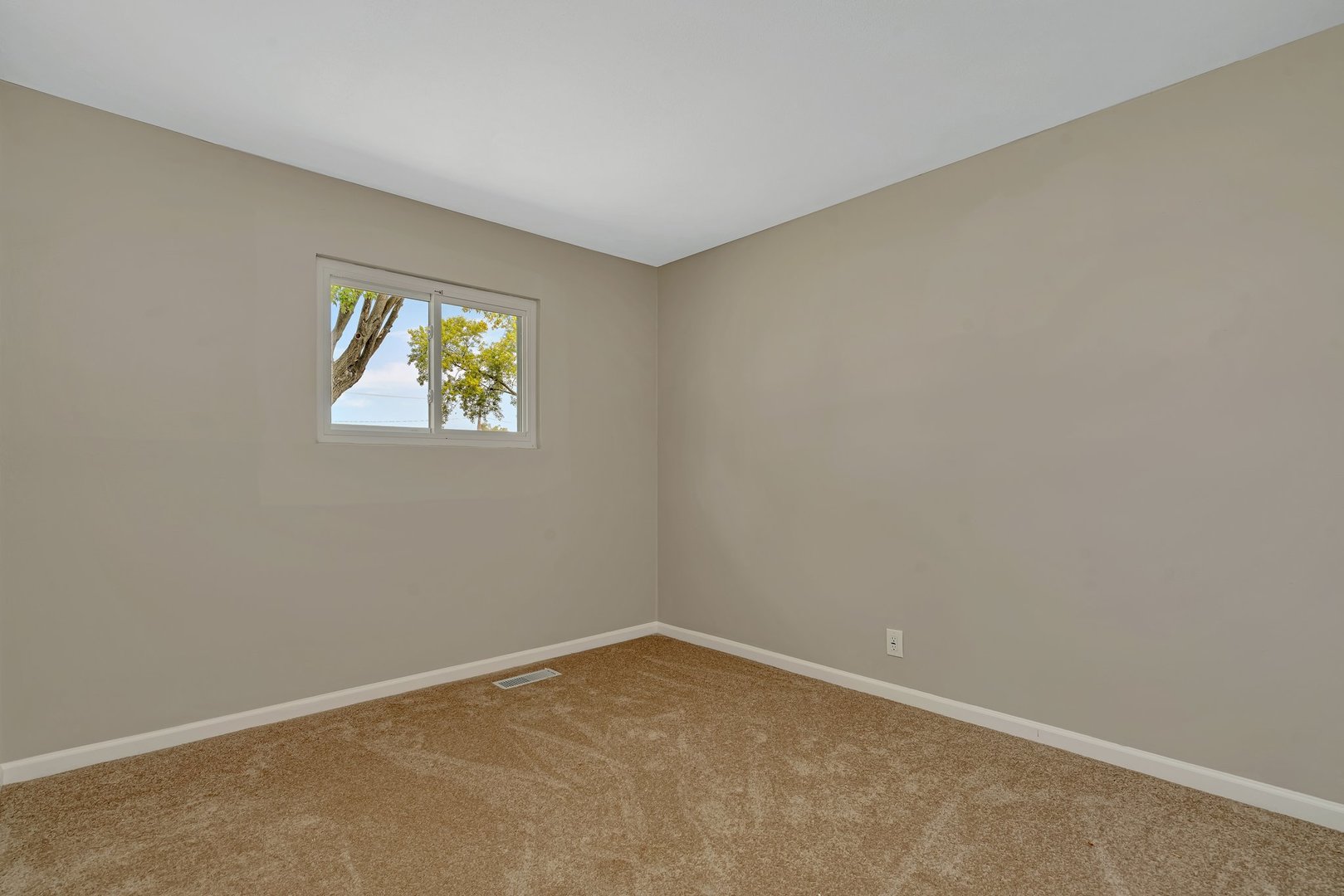144 Queenswood Road Bolingbrook, IL 60440 - Photo 13 of 15 an empty room with windows