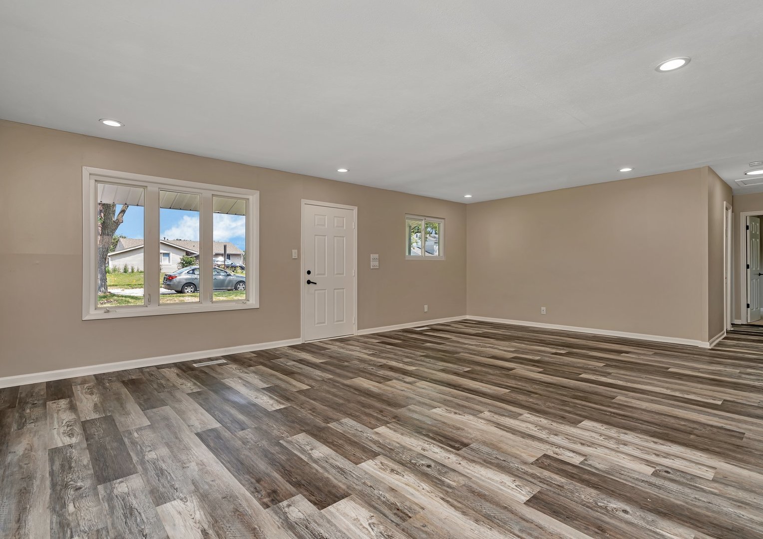 144 Queenswood Road Bolingbrook, IL 60440 - Photo 3 of 15 a view of empty room with wooden floor and fan