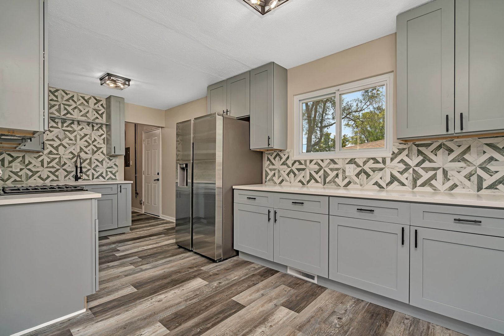 144 Queenswood Road Bolingbrook, IL 60440 - Photo 5 of 15 a view of cabinets with wooden floor