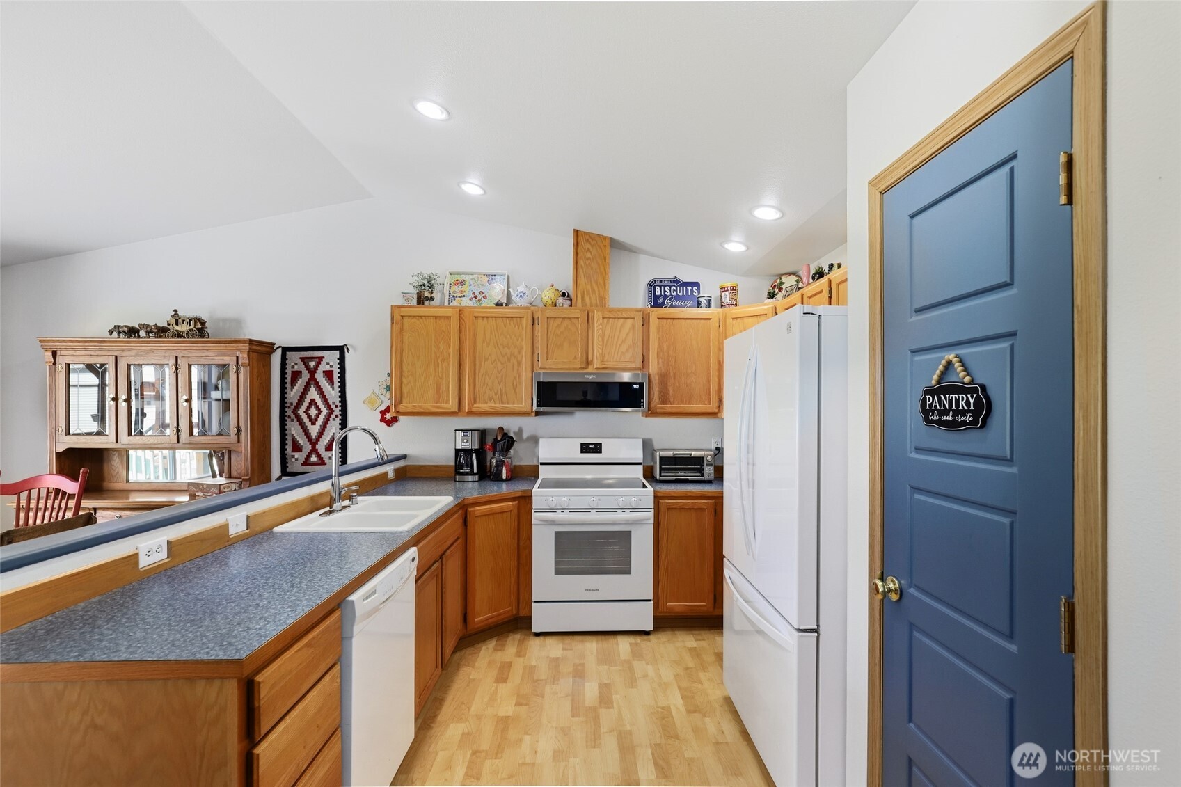 8008 188th Avenue Southwest Rochester, WA 98579 - Photo 13 of 40 a kitchen with a sink stove and refrigerator
