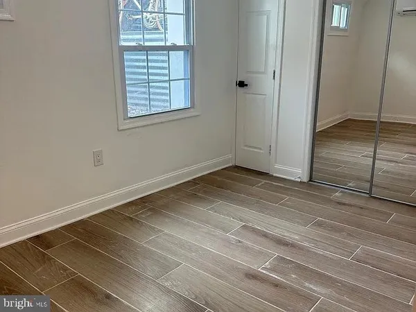 a view of kitchen with cabinets