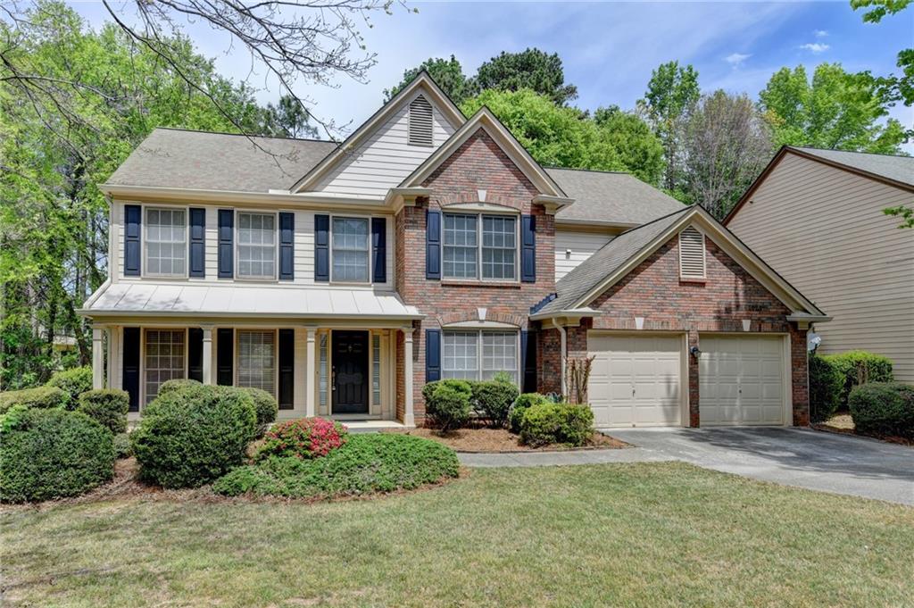 6535 Ganton Drive Duluth, GA 30097 - Photo 2 of 75 front view of a house with a yard
