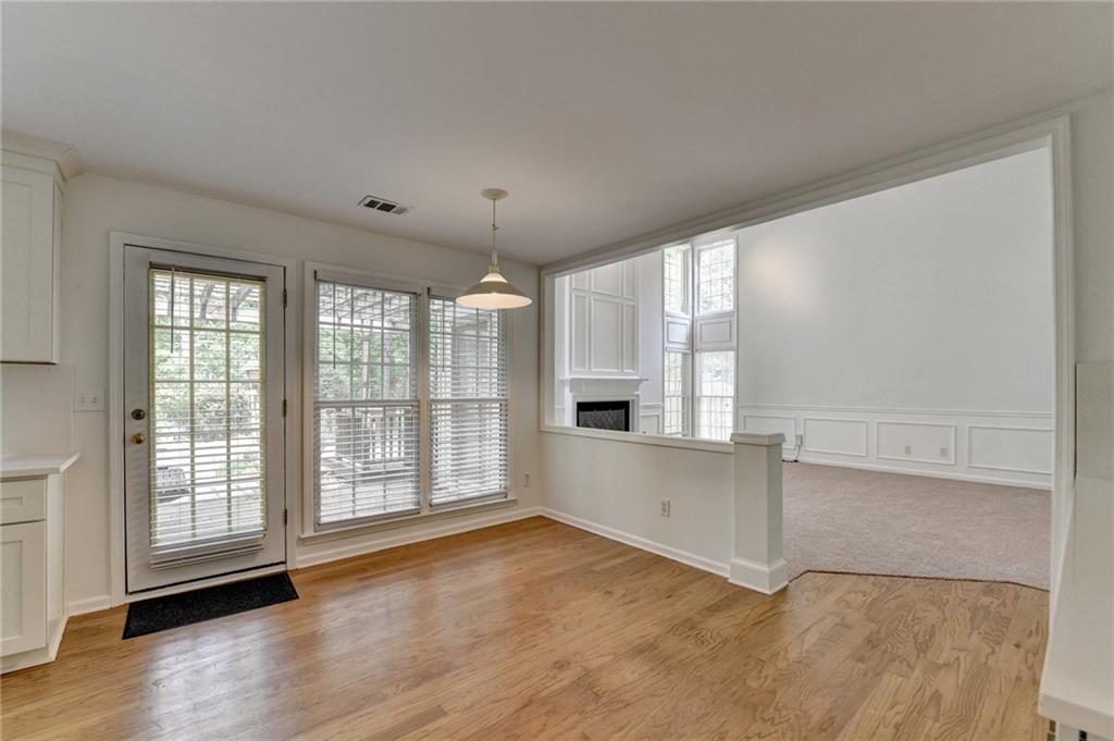 6535 Ganton Drive Duluth, GA 30097 - Photo 27 of 75 an empty room with wooden floor and windows