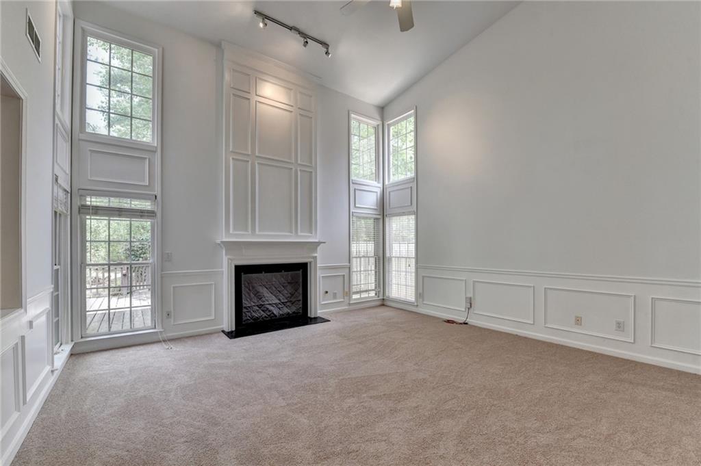 6535 Ganton Drive Duluth, GA 30097 - Photo 33 of 75 an empty room with windows and fireplace