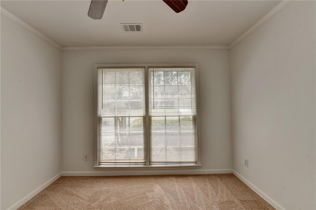 6535 Ganton Drive Duluth, GA 30097 - Photo 41 of 75 an empty room with wooden floor and windows