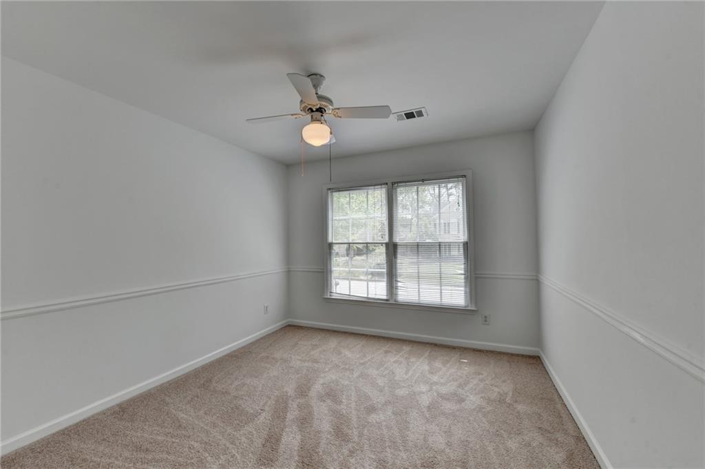 6535 Ganton Drive Duluth, GA 30097 - Photo 43 of 75 an empty room with a empty space and windows