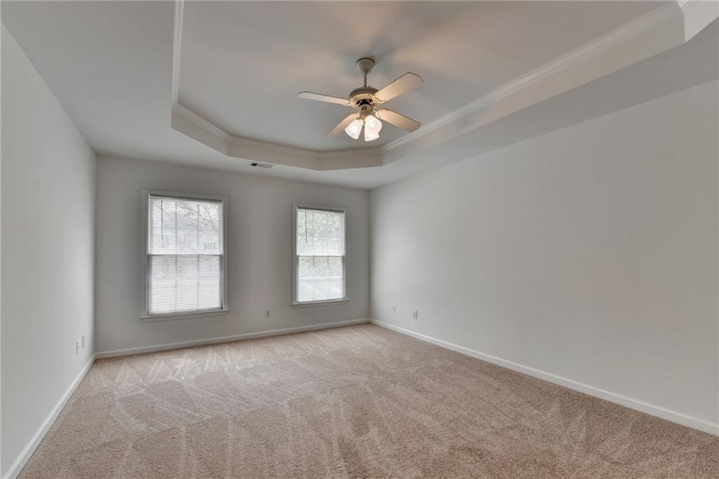 6535 Ganton Drive Duluth, GA 30097 - Photo 47 of 75 an empty room with windows and ceiling fan