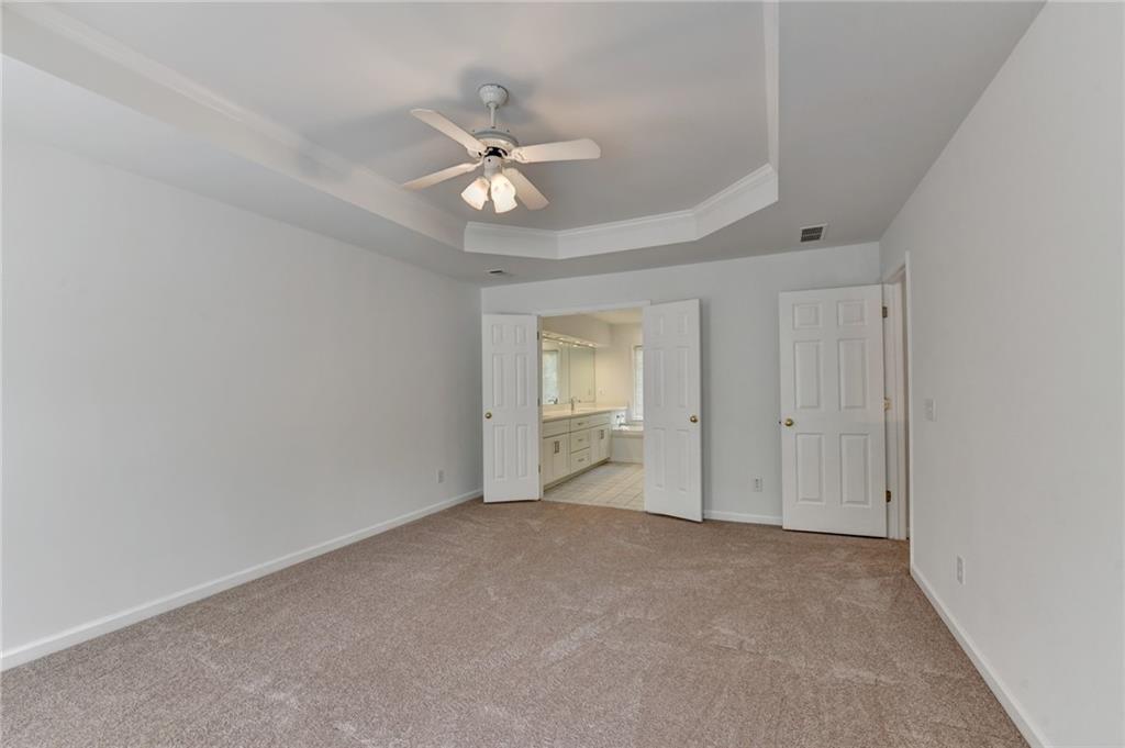 6535 Ganton Drive Duluth, GA 30097 - Photo 49 of 75 a view of an empty room with a fan