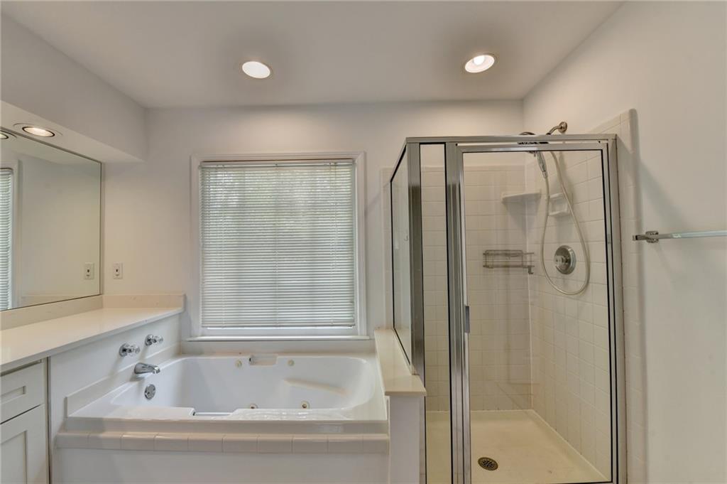 6535 Ganton Drive Duluth, GA 30097 - Photo 54 of 75 a bathroom with a bathtub and shower