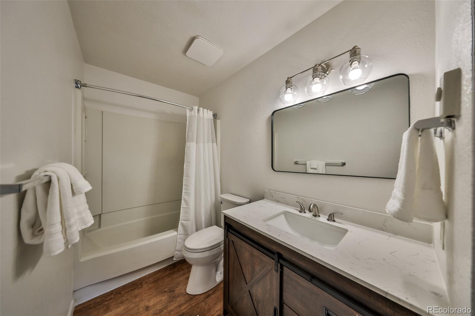 233 Fraser Avenue, Unit R1 Fraser, CO 80442 - Photo 15 of 23 a bathroom with a sink a toilet and shower