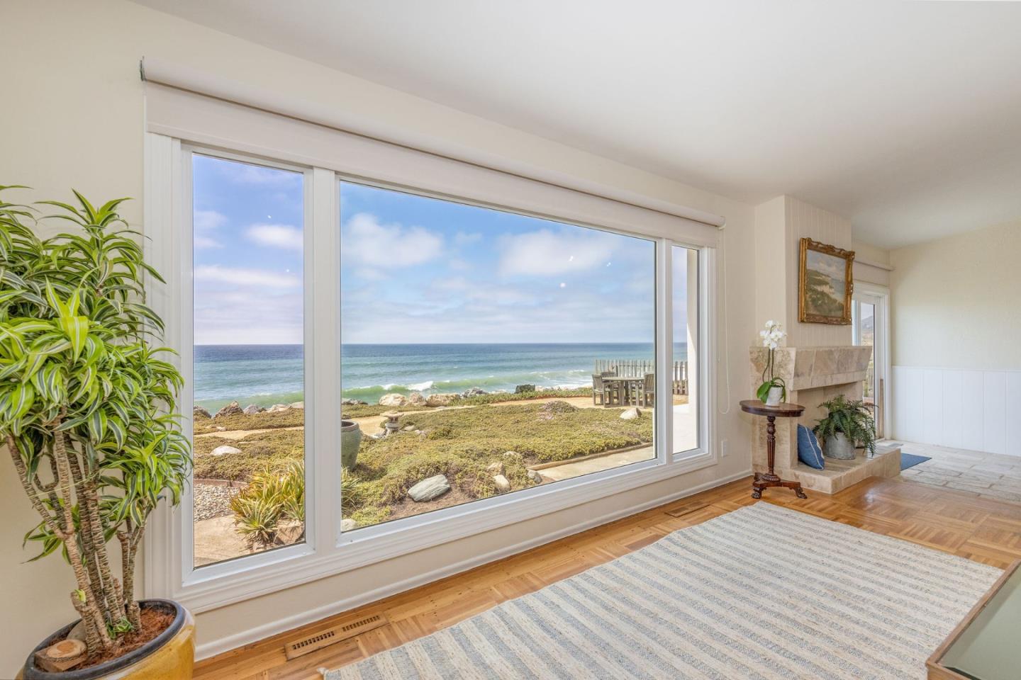 172 Shoreview Avenue Pacifica, CA 94044 - Photo 15 of 38 a view of an empty room with wooden floor and a window