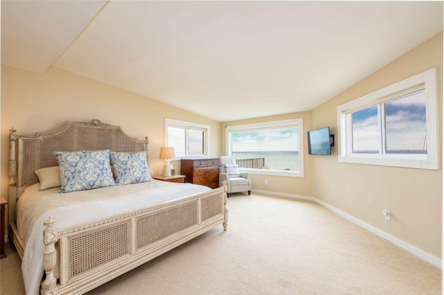 172 Shoreview Avenue Pacifica, CA 94044 - Photo 20 of 38 a spacious bedroom with a bed and a large window