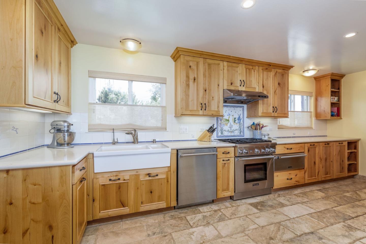 172 Shoreview Avenue Pacifica, CA 94044 - Photo 23 of 38 a kitchen with stainless steel appliances granite countertop a sink stove and cabinets
