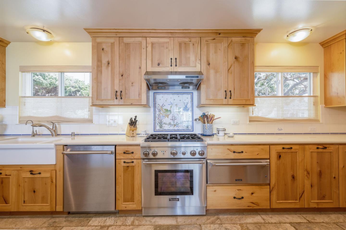 172 Shoreview Avenue Pacifica, CA 94044 - Photo 24 of 38 a kitchen with stainless steel appliances granite countertop a stove and a sink