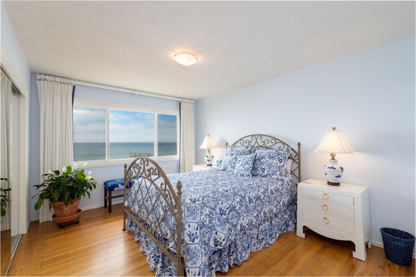 172 Shoreview Avenue Pacifica, CA 94044 - Photo 26 of 38 a bed sitting in a bedroom next to a window