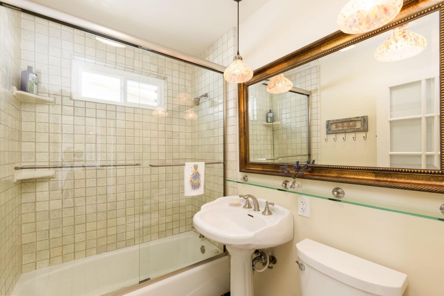 172 Shoreview Avenue Pacifica, CA 94044 - Photo 28 of 38 a bathroom with a sink mirror toilet and bathtub