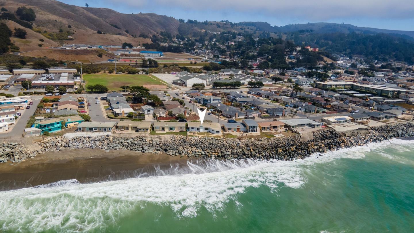 172 Shoreview Avenue Pacifica, CA 94044 - Photo 33 of 38 a view of a lake with mountains in the background
