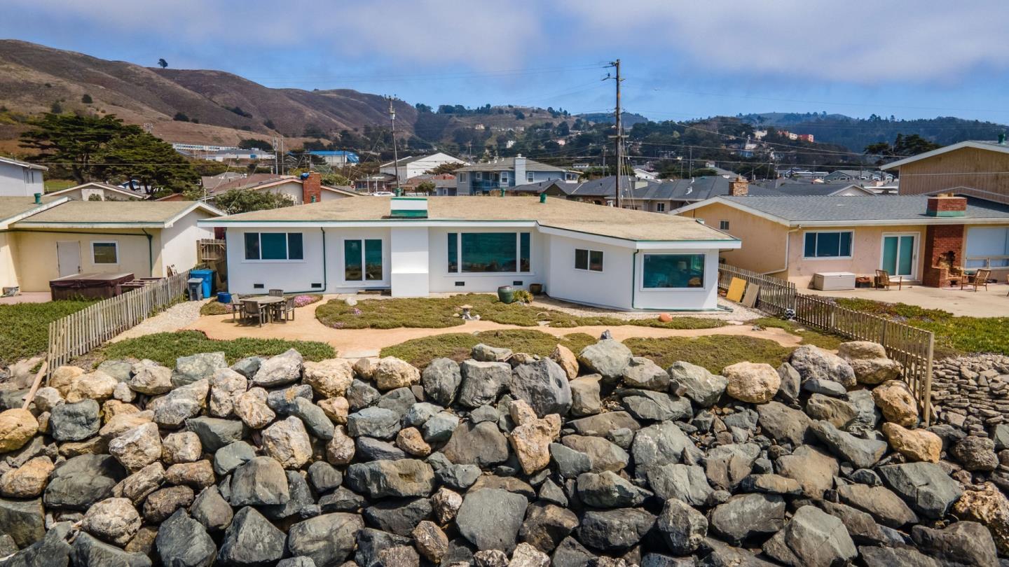 172 Shoreview Avenue Pacifica, CA 94044 - Photo 9 of 38 a view of a house with a big yard and large trees