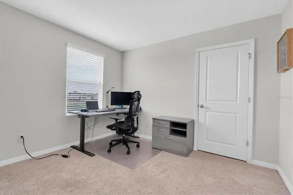 a bedroom with a bed and a table